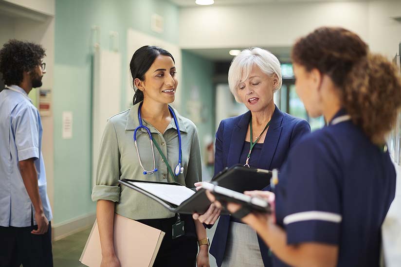 A group of medical practitioners in a hallway