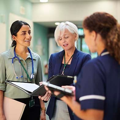 A group of medical practitioners in a hallway