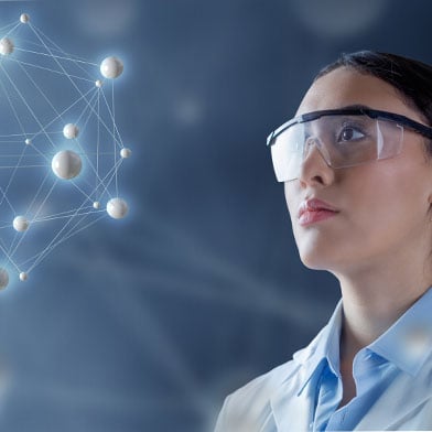 A nurse in protective eyewear gazes at a network of connected nodes, symbolizing the complex data analysis involved in nursing informatics.