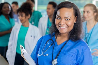 Confident nurse attends hospital staff meeting