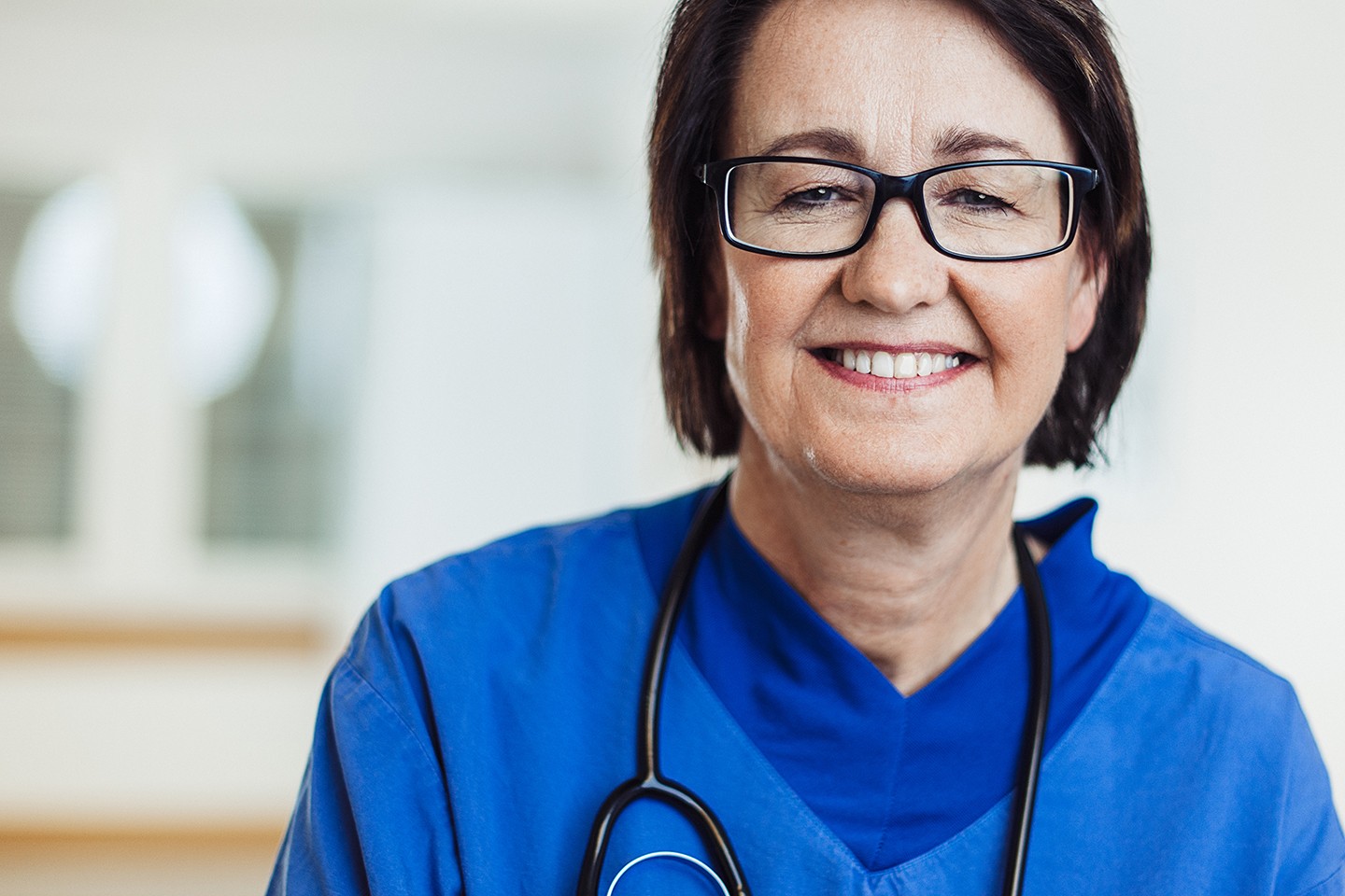 older nurse smiling