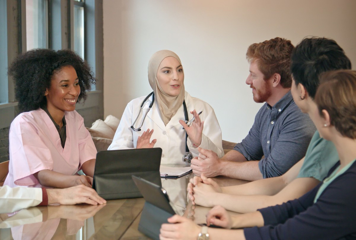 diverse group of nurses at a meeting